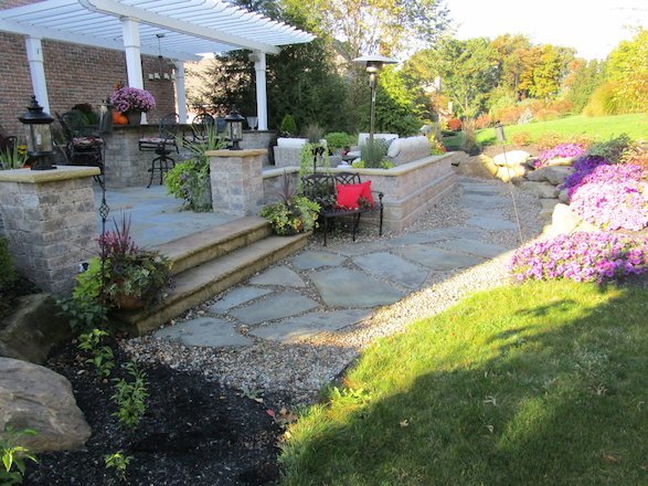 An inviting flagstone walkway to a beautiful outdoor space