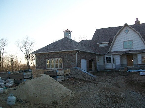 Rice’s laying a home’s cobblestone driveway