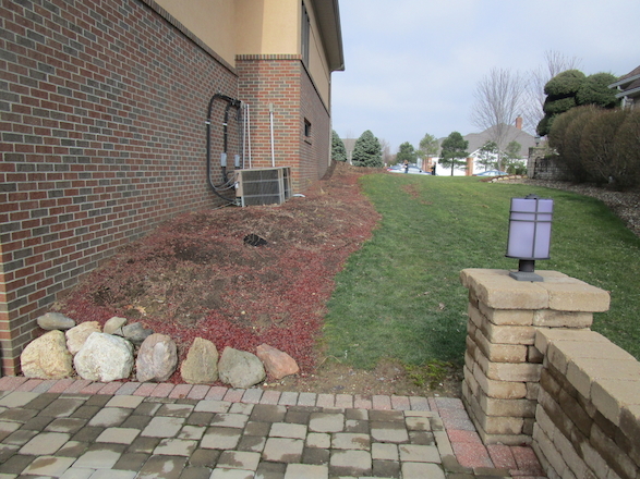 The client desired a sidewalk on the side of the house to allow visitors to access the back patio space from the front driveway without going through the home.