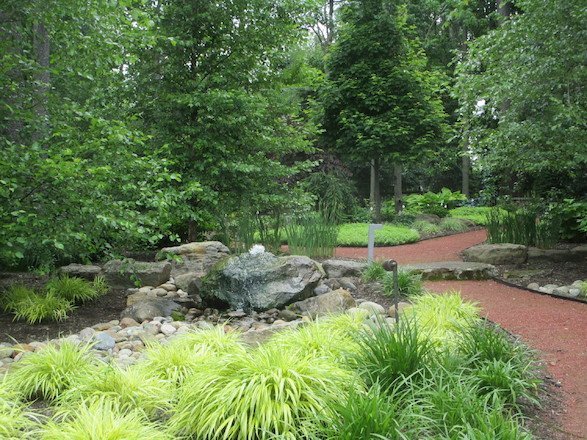 Rocks of various sizes give dimension to this lush garden