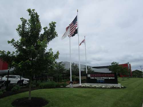 Wide shot of landscaping around Hendrickson's corporate office sign at entrance	