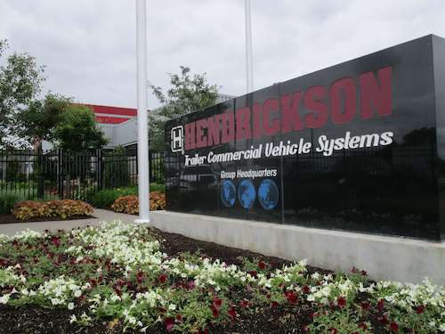 Landscaping around Hendrickson's corporate office sign at entrance