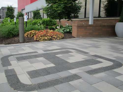 Decorative pavers at entrance of corporate office as part of landscaping design